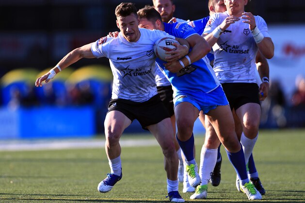 TORONTO, ON - SEPTEMBER 09:  Blake Wallace #6 of Toronto Wolfpack breaks the tackle of Lewis Charnock #7 of Barrow Raiders during a Kingstone Press League 1 Super 8s match at Lamport Stadium on September 9, 2017 in Toronto, Canada.  (Photo by Vaughn Ridley/Getty Images)