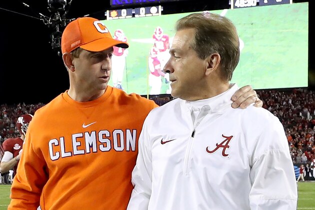 TAMPA, FL - JANUARY 09:  Head coach Dabo Swinney of the Clemson Tigers (L) talks with Head coach Nick Saban of the Alabama Crimson Tide prior to the 2017 College Football Playoff National Championship Game at Raymond James Stadium on January 9, 2017 in Tampa, Florida.  (Photo by Kevin Jairaj - Handout/Getty Images)