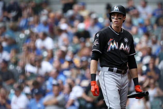 MILWAUKEE, WI - SEPTEMBER 17:  Christian Yelich #21 of the Miami Marlins walks back to the dugout after striking out in the fourth inning against the Milwaukee Brewers at Miller Park on September 17, 2017 in Milwaukee, Wisconsin.  (Photo by Dylan Buell/Getty Images)