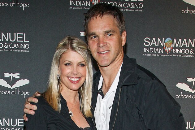 FILE - In this June 23, 2013, file photo, former NHL Player Luc Robitaille and his wife Stacia Robitaille attend Echoes Of Hope's 3rd Annual Luc Robitaille Celebrity Charity Poker Tournament in Los Angeles.  The wife of Hall of Fame hockey player Luc Robitaille has tweeted about an encounter with Donald Trump more than two decades ago in an elevator at Madison Square Garden. (Photo by Paul A. Hebert/Invision/AP, File)