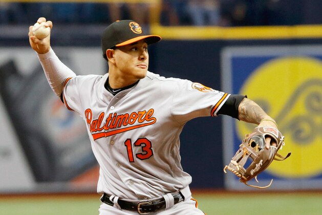 ST. PETERSBURG, FL - OCTOBER 1: Manny Machado #13 of the Baltimore Orioles throws a runner out in the bottom of the second inning of the game against the Tampa Bay Rays at Tropicana Field on October 1, 2017 in St. Petersburg, Florida. (Photo by Joseph Garnett Jr./Getty Images)