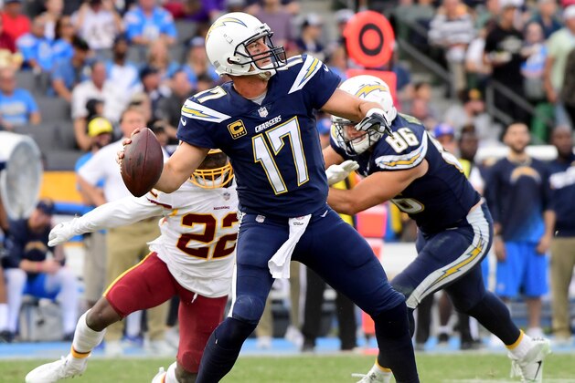 CARSON, CA - DECEMBER 10:   Philip Rivers #17 of the Los Angeles Chargers throws a touchdown pass to  Keenan Allen #13 during the third quarter in a 30-13 win over the Washington Redskins at StubHub Center on December 10, 2017 in Carson, California.  (Photo by Harry How/Getty Images)