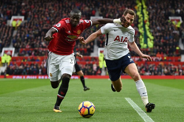 Manchester United's Ivorian defender Eric Bailly (L) vies with Tottenham Hotspur's Belgian defender Jan Vertonghen during the English Premier League football match between Manchester United and Tottenham Hotspur at Old Trafford in Manchester, north west England, on October 28, 2017. / AFP PHOTO / Oli SCARFF / RESTRICTED TO EDITORIAL USE. No use with unauthorized audio, video, data, fixture lists, club/league logos or 'live' services. Online in-match use limited to 75 images, no video emulation. No use in betting, games or single club/league/player publications.  /         (Photo credit should read OLI SCARFF/AFP/Getty Images)