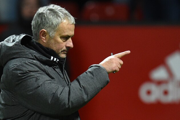 Manchester United's Portuguese manager Jose Mourinho points as he leaves the pitch after winning the English Premier League football match between Manchester United and Bournemouth at Old Trafford in Manchester, north west England, on December 13, 2017. / AFP PHOTO / Oli SCARFF / RESTRICTED TO EDITORIAL USE. No use with unauthorized audio, video, data, fixture lists, club/league logos or 'live' services. Online in-match use limited to 75 images, no video emulation. No use in betting, games or single club/league/player publications.  /         (Photo credit should read OLI SCARFF/AFP/Getty Images)