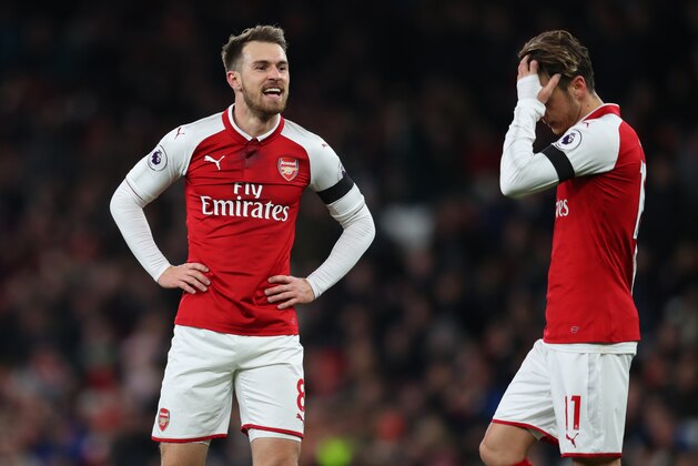 LONDON, ENGLAND - NOVEMBER 29: Aaron Ramsey of Arsenal and Mesut Ozil of Arsenal during the Premier League match between Arsenal and Huddersfield Town at Emirates Stadium on November 29, 2017 in London, England. (Photo by Catherine Ivill/Getty Images)