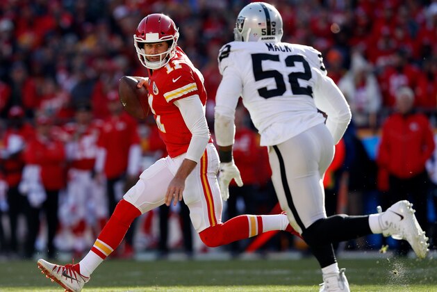 KANSAS CITY, MO - DECEMBER 10:  Quarterback Alex Smith #11 of the Kansas City Chiefs is chased by defensive end Khalil Mack #52 of the Oakland Raiders during the game at Arrowhead Stadium on December 10, 2017 in Kansas City, Missouri.  (Photo by Jamie Squire/Getty Images)