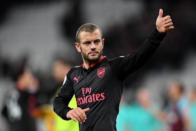 LONDON, ENGLAND - DECEMBER 13: Jack Wilshere of Arsenal shows appreciaton to the fans after the Premier League match between West Ham United and Arsenal at London Stadium on December 13, 2017 in London, England.  (Photo by Shaun Botterill/Getty Images)
