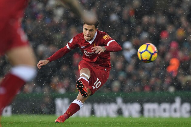 Liverpool's Brazilian midfielder Philippe Coutinho takes a free kick that is saved during the English Premier League football match between Liverpool and Everton at Anfield in Liverpool, north west England on December 10, 2017.  / AFP PHOTO / Paul ELLIS / RESTRICTED TO EDITORIAL USE. No use with unauthorized audio, video, data, fixture lists, club/league logos or 'live' services. Online in-match use limited to 75 images, no video emulation. No use in betting, games or single club/league/player publications.  /         (Photo credit should read PAUL ELLIS/AFP/Getty Images)