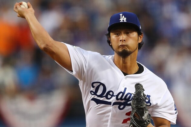 LOS ANGELES, CA - NOVEMBER 01:  Yu Darvish #21 of the Los Angeles Dodgers throws a pitch during the first inning against the Houston Astros in game seven of the 2017 World Series at Dodger Stadium on November 1, 2017 in Los Angeles, California.  (Photo by Tim Bradbury/Getty Images)