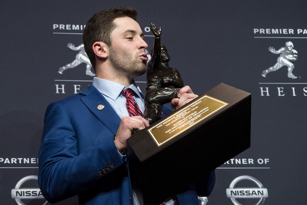 Oklahoma quarterback Baker Mayfield, winner of the Heisman Trophy, poses with the trophy Saturday, Dec. 9, 2017, in New York. (AP Photo/Craig Ruttle) Oklahoma quarterback Baker Mayfield, winner of the Heisman Trophy, poses with the trophy Saturday, Dec. 9, 2017, in New York. (AP Photo/Craig Ruttle)