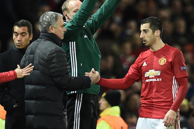 Manchester United's Armenian midfielder Henrikh Mkhitaryan (R) shakes hands with Manchester United's Portuguese manager Jose Mourinho (L) as he is substituted during the UEFA Europa League group A football match between Manchester United and Feyenoord at Old Trafford stadium in Manchester, north-west England, on November 24, 2016. / AFP / Oli SCARFF        (Photo credit should read OLI SCARFF/AFP/Getty Images)