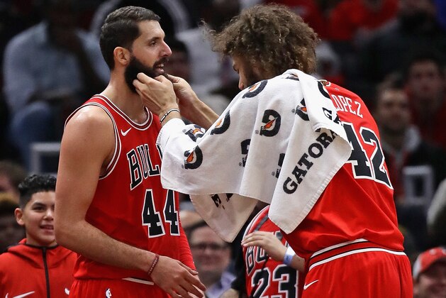 CHICAGO, IL - DECEMBER 11:  Robin Lopez #42 of the Chicago Bulls tickles the beard of Nikola Mirotic #44 of the Chicago Bulls after Mirotic came out of the game against the Boston Celtics at the United Center on December 11, 2017 in Chicago, Illinois. The Bulls defeated the Celtics 108-85. NOTE TO USER: User expressly acknowledges and agrees that, by downloading and or using this photograph, User is consenting to the terms and conditions of the Getty Images License Agreement. (Photo by Jonathan Daniel/Getty Images)