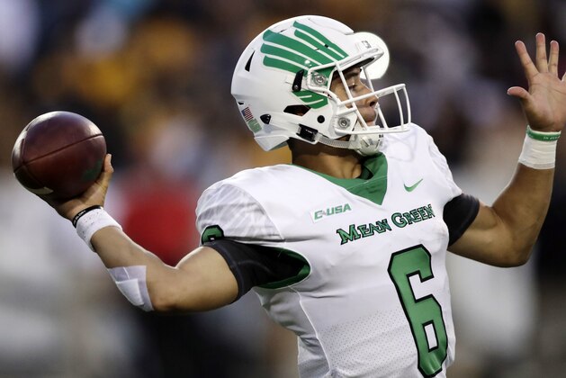 North Texas quarterback Mason Fine (6) looks for an open receiver to pass to against Southern Mississippi in the first half of their NCAA college football game in Hattiesburg, Miss., Saturday, Sept. 30, 2017. North Texas won 43-28. (AP Photo/Rogelio V. Solis)