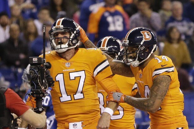 Denver Broncos quarterback Brock Osweiler (17) celebrates his rushing touchdown against the Indianapolis Colts during the first half of an NFL football game in Indianapolis, Thursday, Dec. 14, 2017. (AP Photo/AJ Mast)