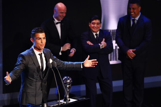 LONDON, ENGLAND - OCTOBER 23:  Cristiano Ronaldo of Portugal and Real Madrid CF wins The best Fifa men's player as Diego Maradona, Gianni Infantino and Ronaldo look on during The Best FIFA Football Awards Show on October 23, 2017 in London, England.  (Photo by Michael Steele/Getty Images)