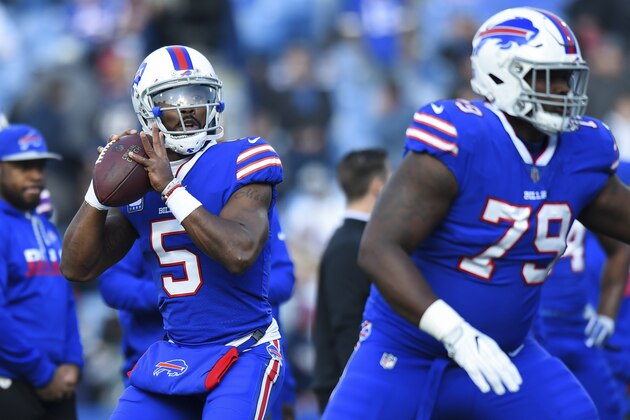 FILE - In this Sunday, Dec. 3, 2017 file photo, Buffalo Bills quarterback Tyrod Taylor (5) warms up prior to an NFL football game New England Patriots in Orchard Park, N.Y.  With his bruised left knee almost fully healed, Tyrod Taylor stood comfortably at the podium requiring no reminder of the doubts and adversity he's had to overcome in preparing to once again reclaim the Buffalo Bills' starting job. (AP Photo/Rich Barnes, File)