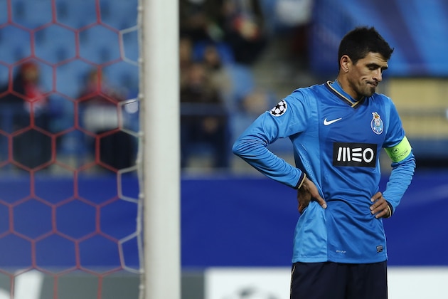 Porto's Lucho Gonzalez gestures during a Champions League Group G soccer match between Atletico Madrid and FC Porto, at the Vicente Calderon stadium in Madrid, Wednesday, Dec. 11, 2013. (AP Photo/Andres Kudacki)