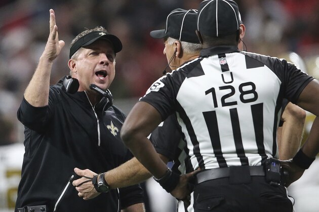 New Orleans Saints head coach Sean Payton speaks to umpire Ramon George during the second half of an NFL football game against the Atlanta Falcons, Thursday, Dec. 7, 2017, in Atlanta. (AP Photo/John Bazemore)