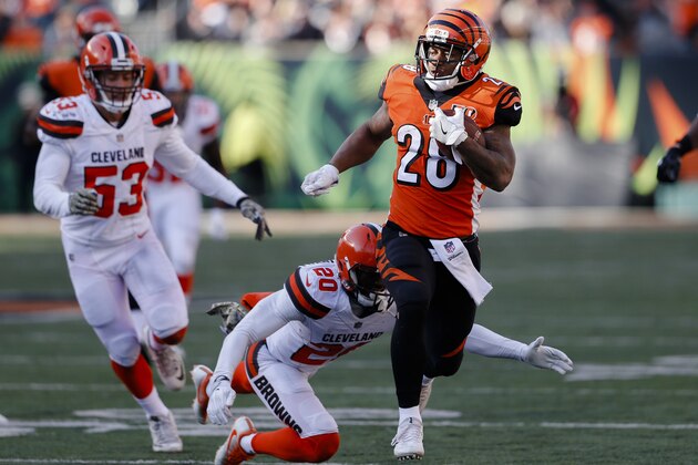 Cincinnati Bengals running back Joe Mixon (28) runs past Cleveland Browns strong safety Briean Boddy-Calhoun (20) in the first half of an NFL football game, Sunday, Nov. 26, 2017, in Cincinnati. (AP Photo/Gary Landers)