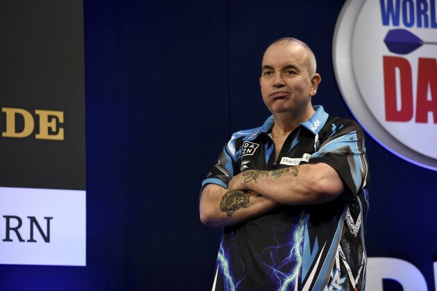 In this Oct. 21, 2017 photo Phil Taylor from England reacting to his defeat in the finals of the German Darts Masters 2017 in the Castello arena, in Duesseldorf, Germany. (Lisa Ducret/dpa via AP)