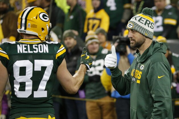 Green Bay Packers' Aaron Rodgers gives Jordy Nelson (87) a thumbs up before an NFL football game against the Detroit Lions Monday, Nov. 6, 2017, in Green Bay, Wis. (AP Photo/Mike Roemer)