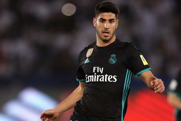 ABU DHABI, UNITED ARAB EMIRATES - DECEMBER 13: Marco Asensio of Real Madrid runs with the ball during the FIFA Club World Cup UAE 2017 semi-final match between Al Jazira and Real Madrid on December 13, 2017 at the Zayed Sports City Stadium in Abu Dhabi, United Arab Emirates.  (Photo by Francois Nel/Getty Images)