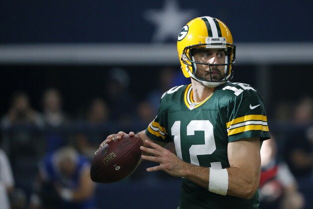 Green Bay Packers quarterback Aaron Rodgers (12) prepares to throw a pass during an NFL football game against the Dallas Cowboys on Sunday, Oct. 8, 2017, in Arlington, Texas. (AP Photo/Roger Steinman)