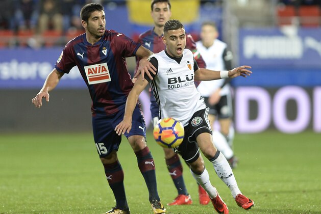 Eibar's Spanish defender Jose Angel (L) vies with Valencia's Brazilian forward Andreas Pereira during the Spanish league football match SD Eibar vs Valencia CF at the Ipurua stadium in Eibar on December 16, 2017.  / AFP PHOTO / ANDER GILLENEA        (Photo credit should read ANDER GILLENEA/AFP/Getty Images)