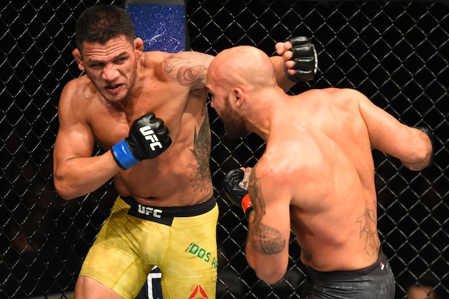 WINNIPEG, CANADA - DECEMBER 16:  (L-R) Rafael Dos Anjos of Brazil punches Robbie Lawler in their welterweight bout during the UFC Fight Night event at Bell MTS Place on December 16, 2017 in Winnipeg, Manitoba, Canada. (Photo by Josh Hedges/Zuffa LLC/Zuffa LLC via Getty Images)