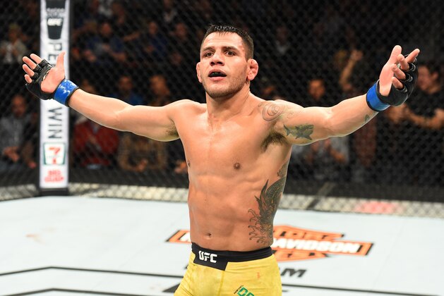 WINNIPEG, CANADA - DECEMBER 16:  Rafael Dos Anjos of Brazil raises his hands after facing Robbie Lawler in their welterweight bout during the UFC Fight Night event at Bell MTS Place on December 16, 2017 in Winnipeg, Manitoba, Canada. (Photo by Josh Hedges/Zuffa LLC/Zuffa LLC via Getty Images)