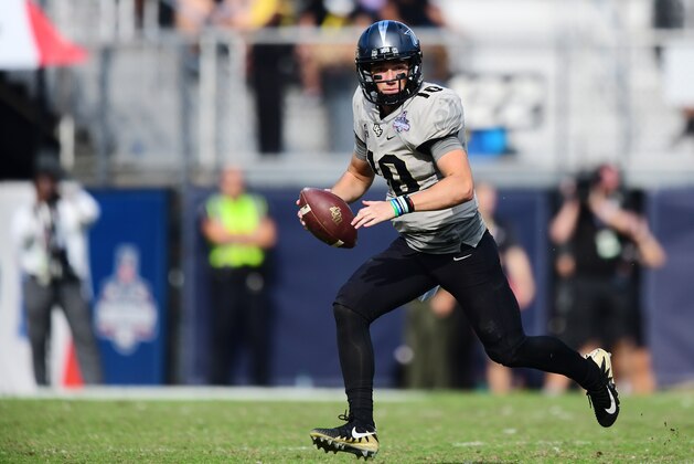 ORLANDO, FL - DECEMBER 2: Quarterback McKenzie Milton #10 of the UCF Knights runs the option during the second quarter of the ACC Championship against the Memphis Tigers at Spectrum Stadium on December 2, 2017 in Orlando, Florida. (Photo by Julio Aguilar/Getty Images)
