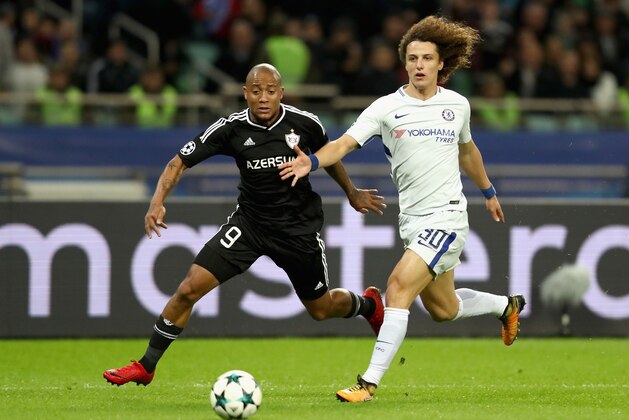 BAKU, AZERBAIJAN - NOVEMBER 22: David Luiz of Chelsea and Dino Ndlovu of Qarabag FK battle for possession during the UEFA Champions League group C match between Qarabag FK and Chelsea FC at Baki Olimpiya Stadionu on November 22, 2017 in Baku, Azerbaijan.  (Photo by Francois Nel/Getty Images)