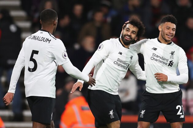 BOURNEMOUTH, ENGLAND - DECEMBER 17:  Mohamed Salah of Liverpool celebrates with teammates Georginio Wijnaldum and Alex Oxlade-Chamberlain after scoring his sides third goal  during the Premier League match between AFC Bournemouth and Liverpool at Vitality Stadium on December 17, 2017 in Bournemouth, England.  (Photo by Catherine Ivill/Getty Images)