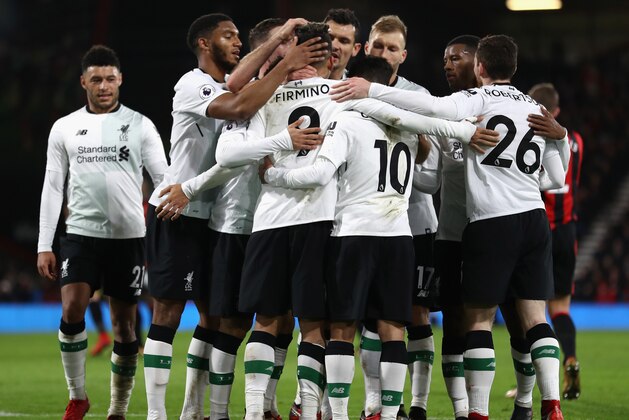 BOURNEMOUTH, ENGLAND - DECEMBER 17:  Roberto Firmino of Liverpool celebrates with his teammates after scoring his sides fourth goal during the Premier League match between AFC Bournemouth and Liverpool at Vitality Stadium on December 17, 2017 in Bournemouth, England.  (Photo by Bryn Lennon/Getty Images)