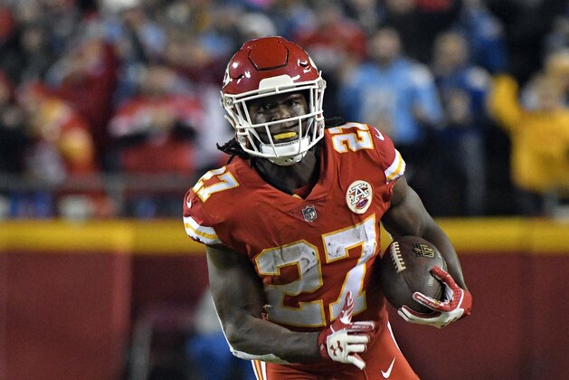 Kansas City Chiefs running back Kareem Hunt (27) carries the ball during the first half of an NFL football game against the Los Angeles Chargers in Kansas City, Mo., Saturday, Dec. 16, 2017. (AP Photo/Ed Zurga)