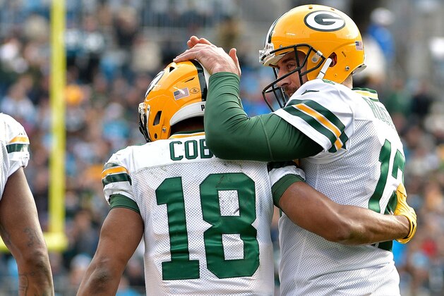 CHARLOTTE, NC - DECEMBER 17:  Aaron Rodgers #12 celebrates with teammate Randall Cobb #18 of the Green Bay Packers after a touchdown against the Carolina Panthers in the second quarter during their game at Bank of America Stadium on December 17, 2017 in Charlotte, North Carolina.  (Photo by Grant Halverson/Getty Images)