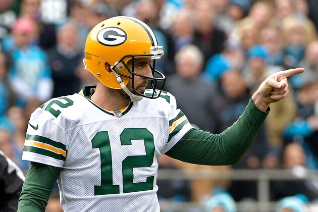 CHARLOTTE, NC - DECEMBER 17:  Aaron Rodgers #12 of the Green Bay Packers reacts after a touchdown pass against the Carolina Panthers in the first quarter during their game at Bank of America Stadium on December 17, 2017 in Charlotte, North Carolina.  (Photo by Grant Halverson/Getty Images)
