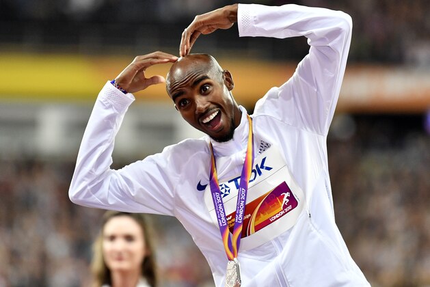 Men's 5000 meters silver medalist Britain's Mo Farah gestures on the podium following the medal ceremony at the World Athletics Championships in London Saturday, Aug. 12, 2017. (AP Photo/Martin Meissner)