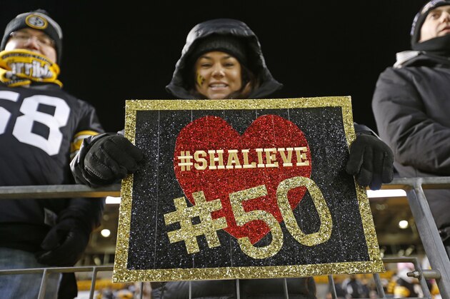 A Pittsburgh Steelers fan holds a sign for Steelers' Ryan Shazier, who suffered a spinal cord injury in last week's game against the Cincinnati Bengals, before an NFL football game in Pittsburgh, Sunday, Dec. 10, 2017. (AP Photo/Keith Srakocic)
