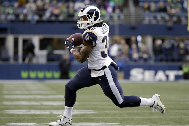 Los Angeles Rams running back Todd Gurley runs for a touchdown, his fourth of the game, after making a catch in the second half of an NFL football game against the Seattle Seahawks, Sunday, Dec. 17, 2017, in Seattle. (AP Photo/Elaine Thompson)