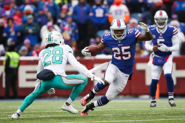 ORCHARD PARK, NY - DECEMBER 17:  Bobby McCain #28 of the Miami Dolphins attempts to defend LeSean McCoy #25 of the Buffalo Bills during the first quarter on December 17, 2017 at New Era Field in Orchard Park, New York.  (Photo by Tom Szczerbowski/Getty Images)