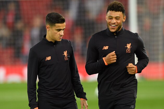 LIVERPOOL, ENGLAND - SEPTEMBER 13:  Philippe Coutinho of Liverpool warms up with team mate Alex Oxlade-Chamberlain prior to the UEFA Champions League group E match between Liverpool FC and Sevilla FC at Anfield on September 13, 2017 in Liverpool, United Kingdom.  (Photo by Stu Forster/Getty Images)