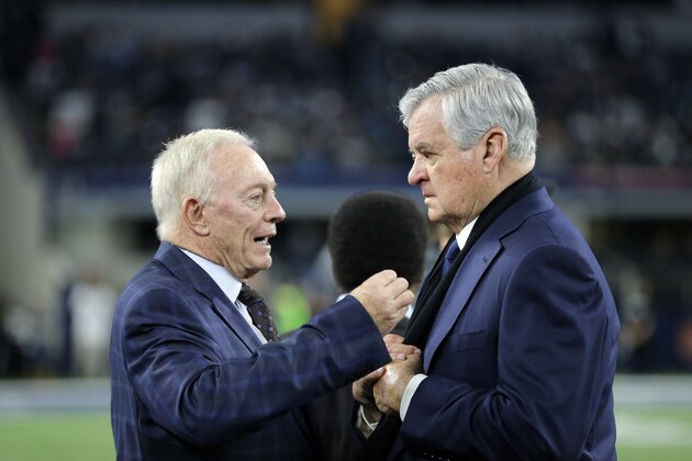 Dallas Cowboys team owner Jerry Jones, left, and Jerry Richardson, principal owner of the Carolina Panthers talk on the field before an NFL football game, Thursday, Nov. 26, 2015, in Arlington, Texas. (AP Photo/Brandon Wade)