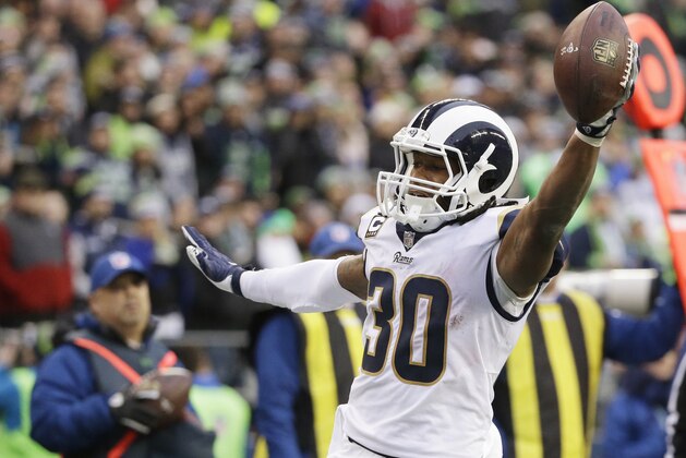 Los Angeles Rams running back Todd Gurley scores a touchdown in the second half of an NFL football game against the Seattle Seahawks, Sunday, Dec. 17, 2017, in Seattle. (AP Photo/Elaine Thompson)