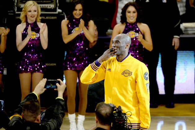 LOS ANGELES, CA - APRIL 13:  Kobe Bryant #24 of the Los Angeles Lakers waves to the crowd as he walks on the court before the game against the Utah Jazz on April 13, 2016 at Staples Center in Los Angeles, California.  (Photo by Kevork Djansezian/Getty Images)