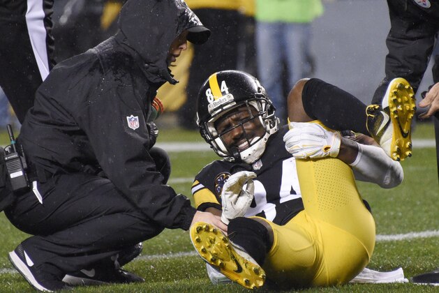Pittsburgh Steelers wide receiver Antonio Brown (84) is helped by a trainer after being injured during the first half of an NFL football game against the New England Patriots in Pittsburgh, Sunday, Dec. 17, 2017. (AP Photo/Don Wright)
