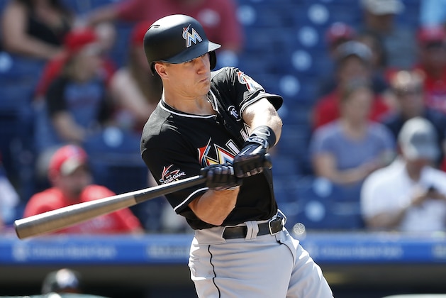 Miami Marlins' J.T. Realmuto (11) hits a two-run inside the park home run against the Philadelphia Phillies during the sixth inning of a baseball game Thursday, Aug. 24, 2017, in Philadelphia, Pa. The Marlins defeated the Phillies 9-4. (AP Photo/Rich Schultz)