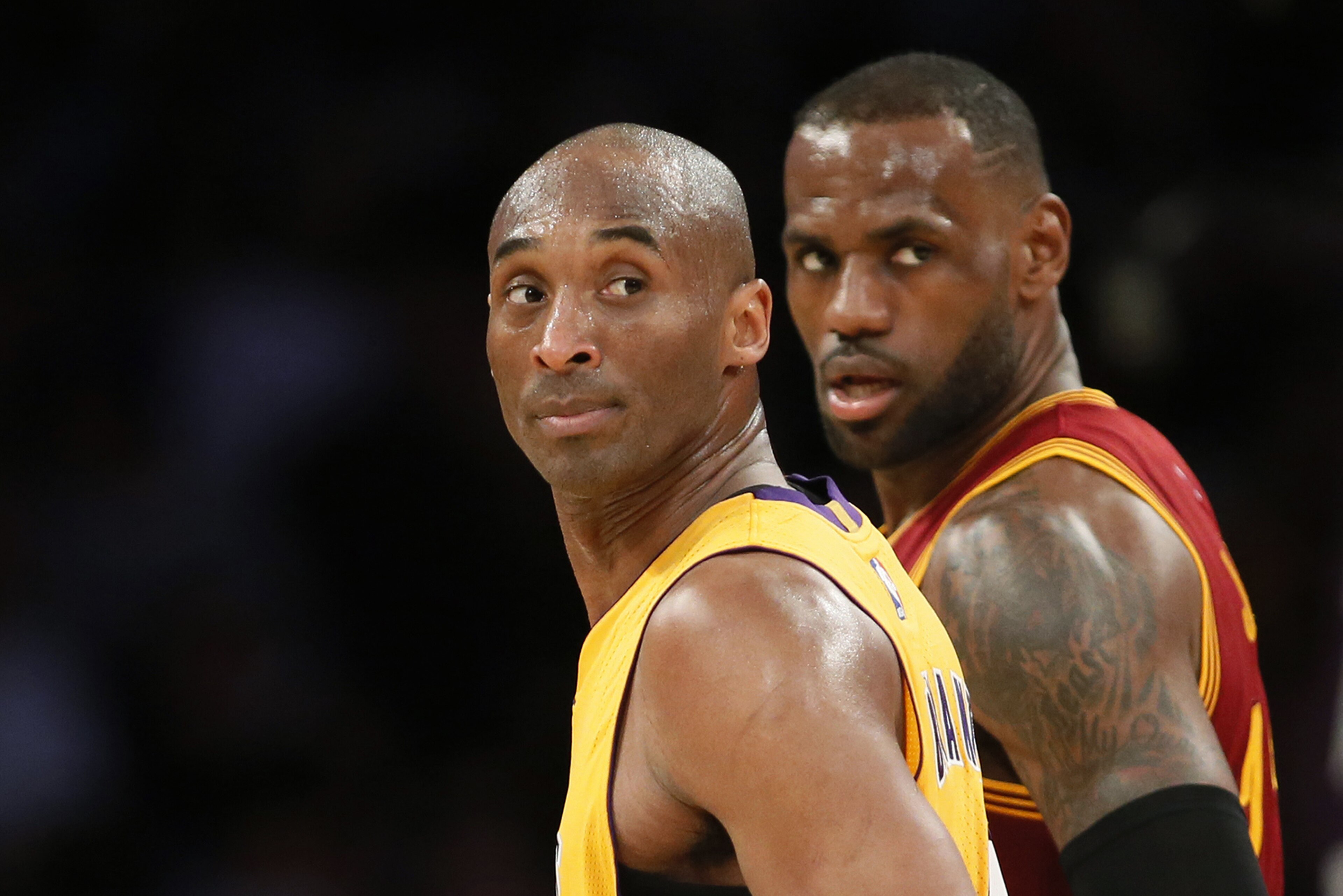 FILE - In this March 10, 2016 file photo, Los Angeles Lakers' Kobe Bryant, left, and Cleveland Cavaliers' LeBron James wait for play to resume during the first half of an NBA basketball game in Los Angeles. For months, the Cavaliers' megastar has lived slightly under the radar, if that's even possible for one of the world's most famous and recognizable athletes. While Stephen Curry rained 3-pointers as the new face of the NBA, the Golden State Warriors hunted down history and Kobe Bryant took his final bows, James remained in the background awaiting his turn. (AP Photo/Danny Moloshok, File) FILE - In this March 10, 2016 file photo, Los Angeles Lakers' Kobe Bryant, left, and Cleveland Cavaliers' LeBron James wait for play to resume during the first half of an NBA basketball game in Los Angeles. For months, the Cavaliers' megastar has lived slightly under the radar, if that's even possible for one of the world's most famous and recognizable athletes. While Stephen Curry rained 3-pointers as the new face of the NBA, the Golden State Warriors hunted down history and Kobe Bryant took his final bows, James remained in the background awaiting his turn. (AP Photo/Danny Moloshok, File)