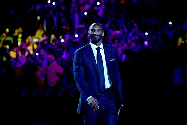 LOS ANGELES, CA - DECEMBER 18:  Kobe Bryant smiles at halftime as both his #8 and #24 Los Angeles Lakers jerseys are retired at Staples Center on December 18, 2017 in Los Angeles, California. NOTE TO USER: User expressly acknowledges and agrees that, by downloading and or using this photograph, User is consenting to the terms and conditions of the Getty Images License Agreement.  (Photo by Harry How/Getty Images)