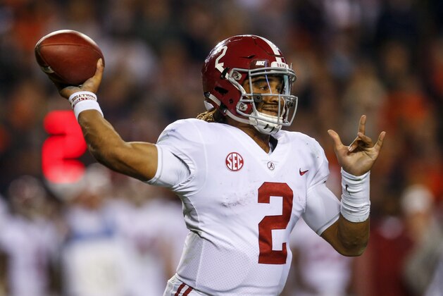 Alabama quarterback Jalen Hurts (2) throws a pass during the second half of the Iron Bowl NCAA college football game against Auburn, Saturday, Nov. 25, 2017, in Auburn, Ala. (AP Photo/Butch Dill)